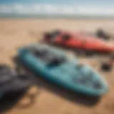 Essential kitesurfing gear laid out on a sandy beach