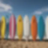 Diverse kitesurfing surfboards lined up on a beach